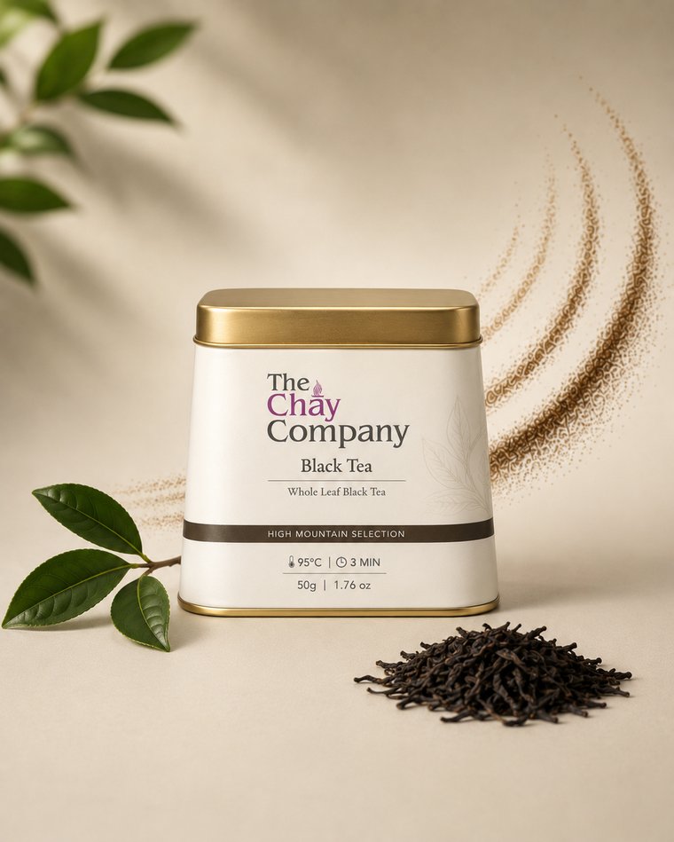 The Chay Company Black Tea tin, whole leaf, with loose leaves and a tea branch