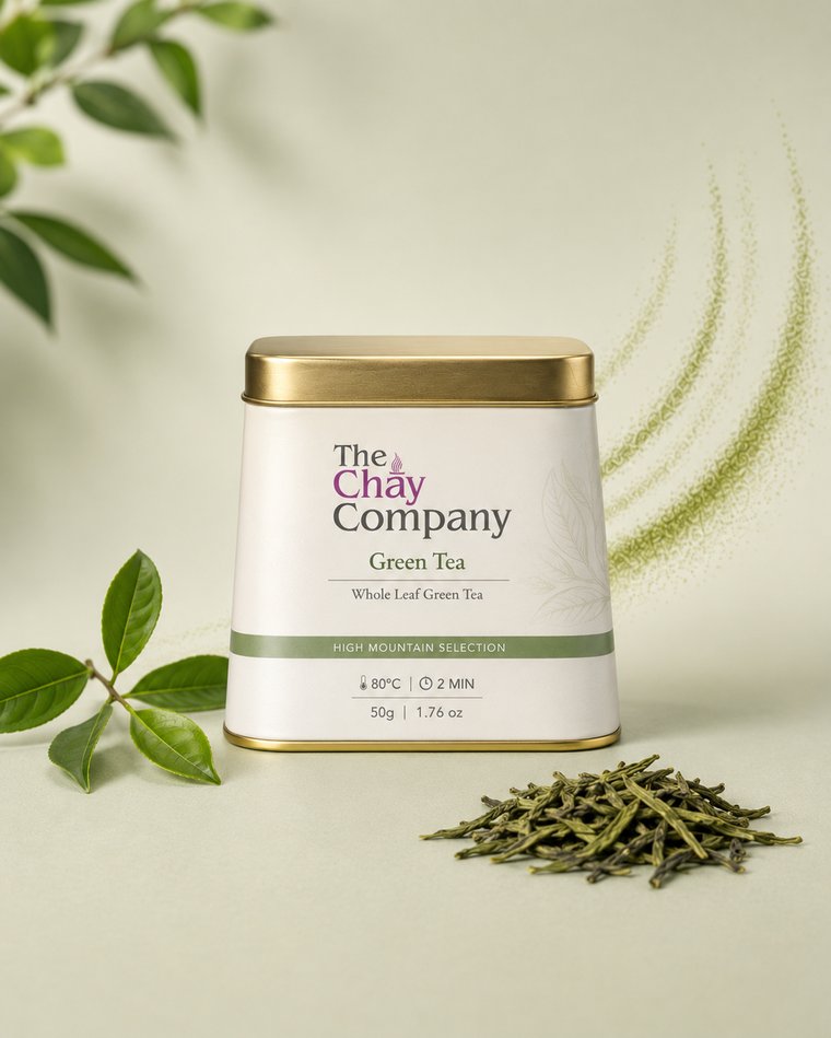 The Chay Company Green Tea tin, whole leaf, with loose leaves and a tea branch